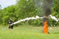 firefighter extinguish a burning tire during demonstration performances