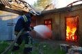 Firefighter extinguishes fire