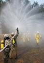 Firefighter extinguishes fire Royalty Free Stock Photo