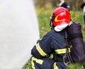 Firefighter extinguishes fire Royalty Free Stock Photo