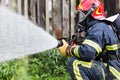 Firefighter extinguishes fire Royalty Free Stock Photo