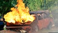 Firefighter fighting with flame using fire hose chemical water foam spray engine. Fireman wear hard hat, body safe suit uniform Royalty Free Stock Photo