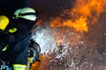 Firefighter - Firemen extinguishing a large blaze Royalty Free Stock Photo