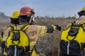 Firefighter giving instructions on how to attack the forest fire