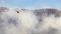 A firefighter helicopter rushes to help put out a wildfire