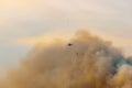 firefighter helicopter flying over fire smoke Royalty Free Stock Photo