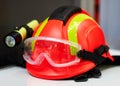 Firefighter helmet with flashlight, close-up. Construction helmet with headlamp Royalty Free Stock Photo