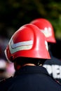 Firefighter helmets seen from behind