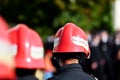 Firefighter helmets seen from behind during parade