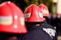 Firefighter helmets seen from behind during parade