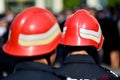 Firefighter helmets seen from behind during parade