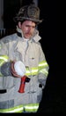Firefighter displays a smake detector that saved a life