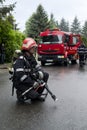 Firefighter near firetruck