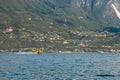 Firefighter plane taking water from Garda lake