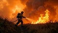 firefighter in protective suit with fire hose in hands extinguishes fire. grass field burns with open flame, firefighter Royalty Free Stock Photo
