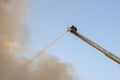 Firefighter putting out fire Royalty Free Stock Photo