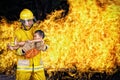 firefighter., rescue fireman save a child from fire incident. Royalty Free Stock Photo