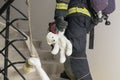 Firefighter rescued a teddy bear child, side view Royalty Free Stock Photo