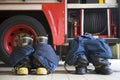Firefighter's boots and trousers in a fire station Royalty Free Stock Photo