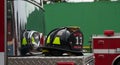 Firefighter\'s helmet perched atop a fire engine, embodying duty and valor Royalty Free Stock Photo