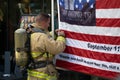 Firefighter Signs Flag At San Antonio 110 9/11 memorial climb