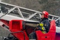 Firefighters operating crane arm Royalty Free Stock Photo