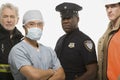 Firefighter surgeon police officer and construction worker Royalty Free Stock Photo