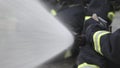 Firefighter team spay water to fire