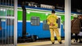 Firefighter on the train station helping Ukrainian people