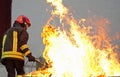 Firefighter during a training exercise off a huge fire in the br Royalty Free Stock Photo