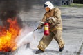 Firefighter during training with a huge fire in the brazier Royalty Free Stock Photo