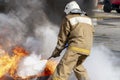 Firefighter during training with a huge fire in the brazier Royalty Free Stock Photo