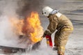 Firefighter during training with a huge fire in the brazier Royalty Free Stock Photo