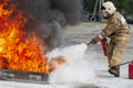 Firefighter during training with a huge fire in the brazier Royalty Free Stock Photo