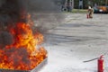 Firefighter during training with a huge fire in the brazier Royalty Free Stock Photo