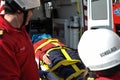 Firefighter transport patient on ambulance