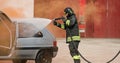 Firefighter uses foam on the car