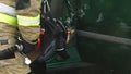 Firefighter uses jaws of life to extricate trapped victim from the car