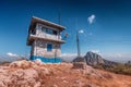 Firefighter watchtower looks out for wildfires built on top of a mountain in an arid climate in a nature reserve Royalty Free Stock Photo