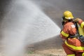 Firefighter water spray by high pressure fire hose