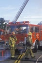 Firefighter working with fire hose, Los Angeles, California