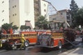 Firefighter working with fire hose, Los Angeles, California