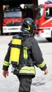 Firefighter with yellow oxygen cylinder and the helmet Royalty Free Stock Photo