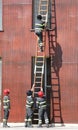 firefighters in action during the exercise in the fire station w Royalty Free Stock Photo