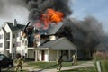 Firefighters battle an apartment fire Royalty Free Stock Photo