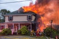 Firefighters battle blazing house fire Royalty Free Stock Photo