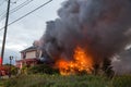 Firefighters battle blazing house fire