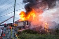 Firefighters battle blazing house fire