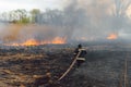 Firefighters battle a wildfire. firefighters spray water to wildfire. Australia bushfires, The fire is fueled by wind and heat