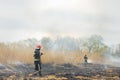 Firefighters battle a wildfire. firefighters spray water to wildfire. Australia bushfires, The fire is fueled by wind and heat